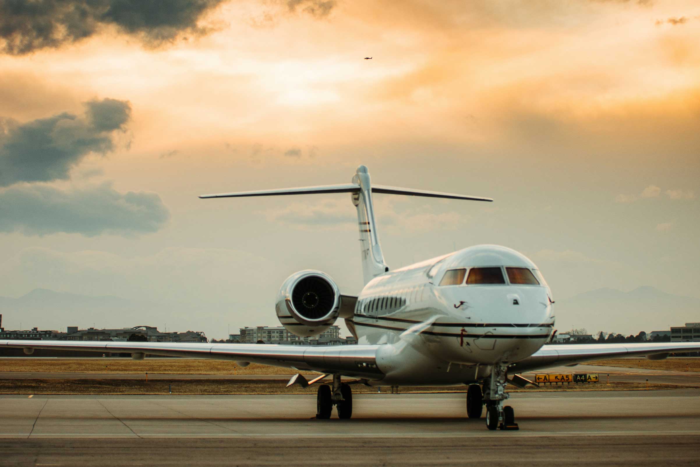 Plane on a runway at sunset
